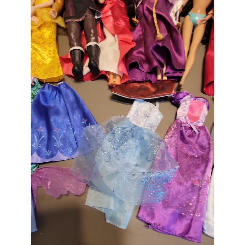 Disney Barbie dolls with extra dresses shoes etc... Mixed lot